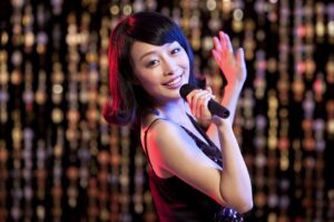 Young woman singing Karaoke