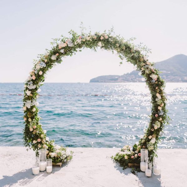 WEDDING ARCH RECEPTION WITH SEA VIEW in Montenegro. White wedding reception venue with sea and mountains view. Destination wedding venue.